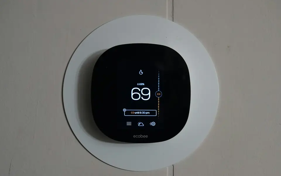 Smart thermostat mounted on a wall