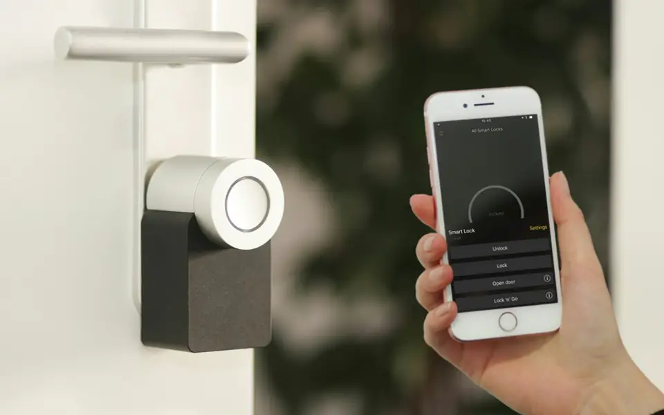 Smart lock on a front door controlled from a phone