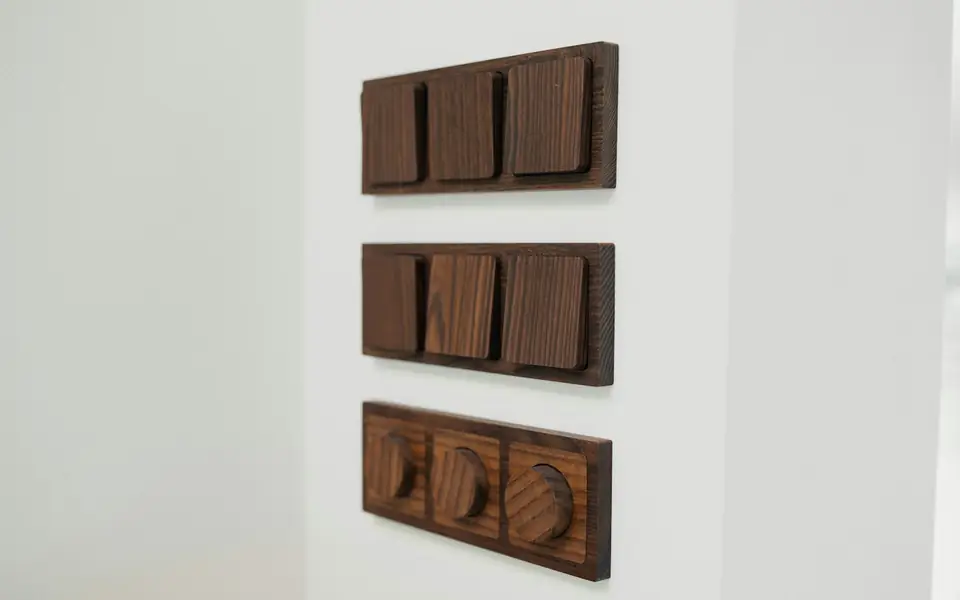 Wooden smart switch panels on a white wall